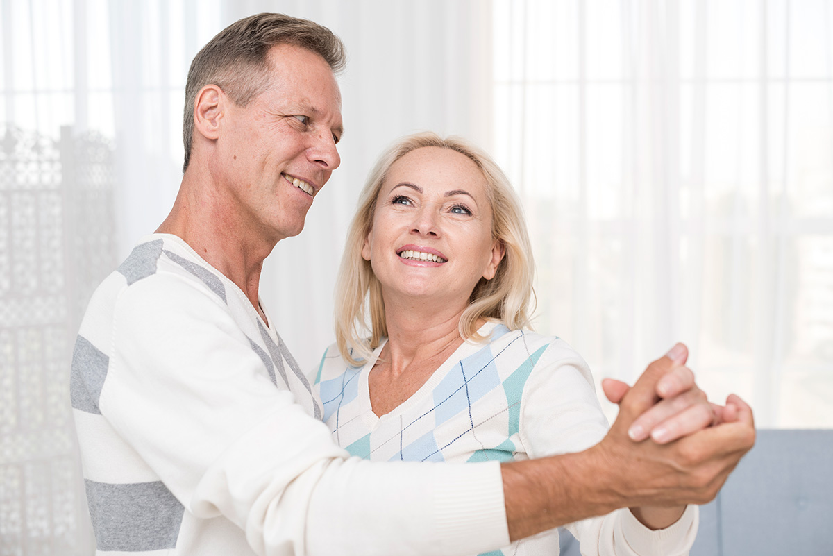 medium-shot-couple-dancing-living-room